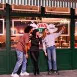 Three friends taking a selfie outside of Central Perk