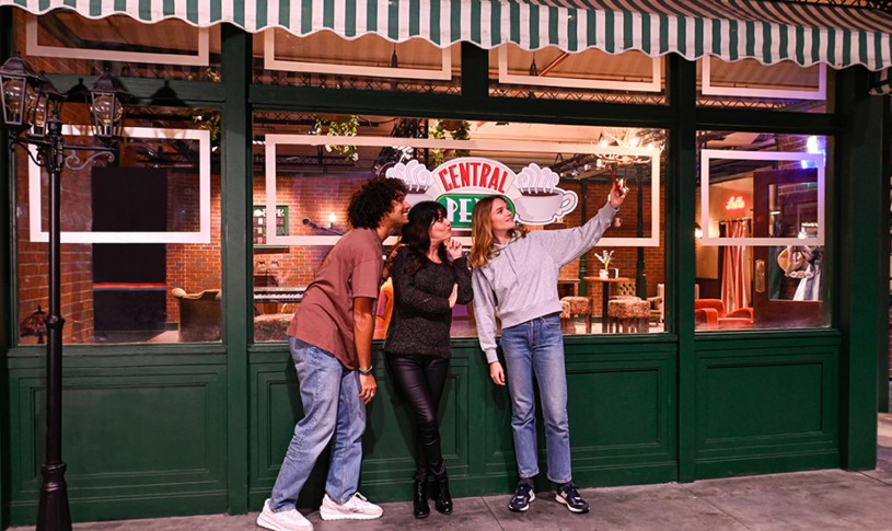 Three friends taking a selfie outside of Central Perk