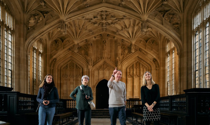 Group in the Divinity School with good view of ceiling