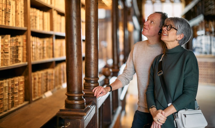 Smiling couple in front of Arts End lower shelving